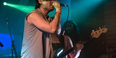 A photo of band performing on stage