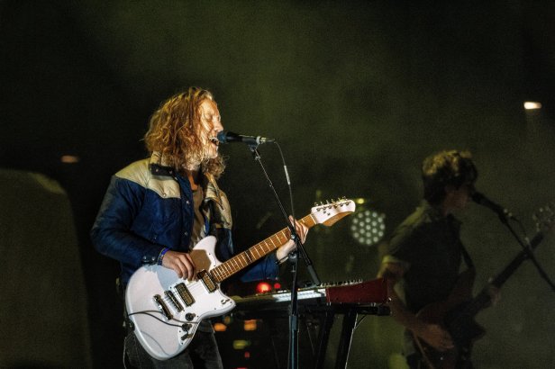 A picture of the lead singer for the band Flor on stage at the House of Blues
