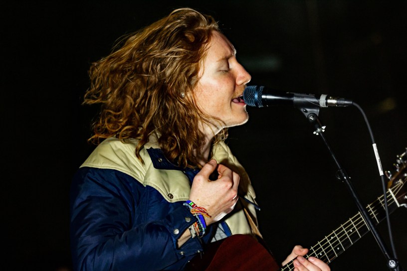 A close up image of the lead singer of the band Flor