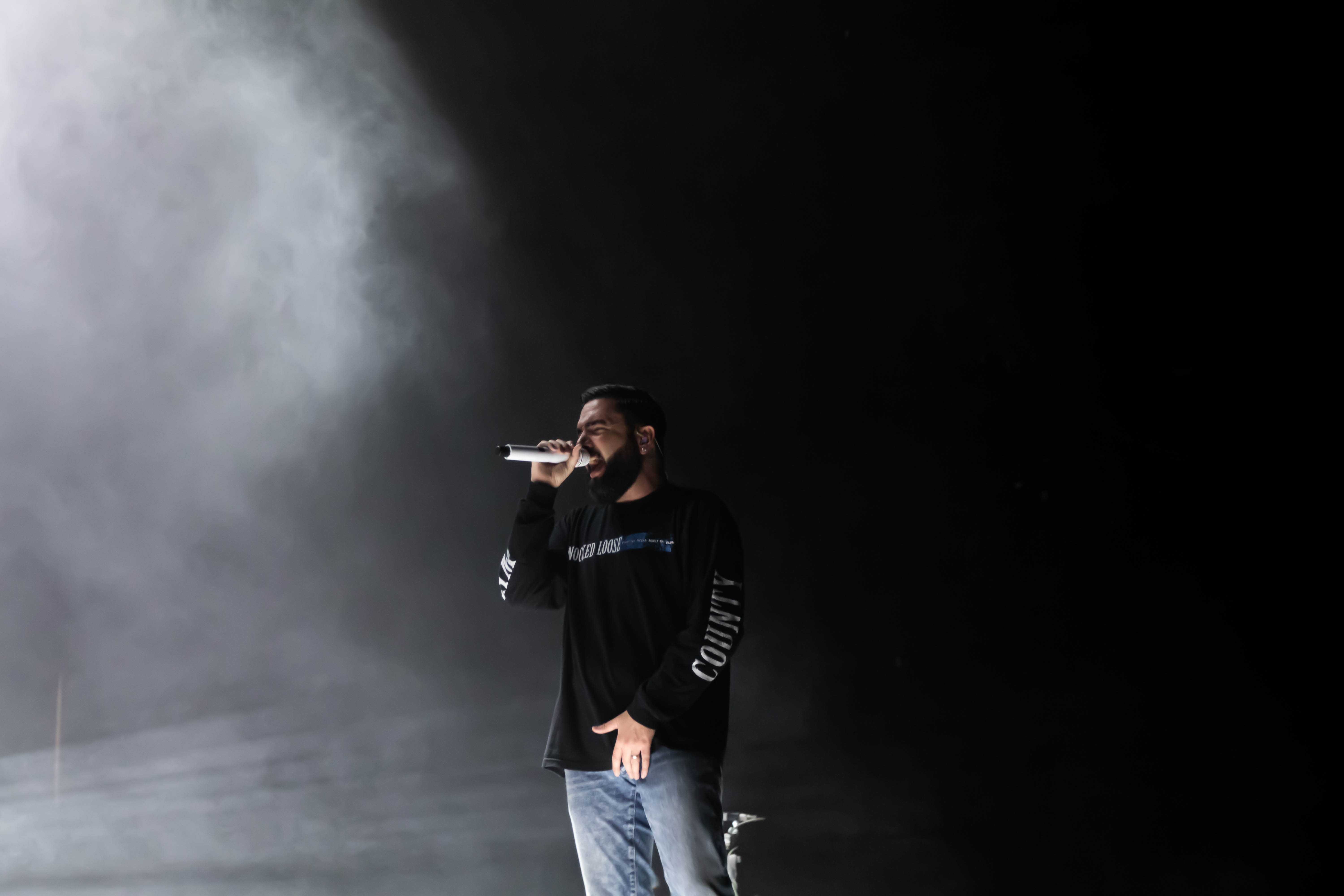 singer Jeremy McKinnon singing into a microphone